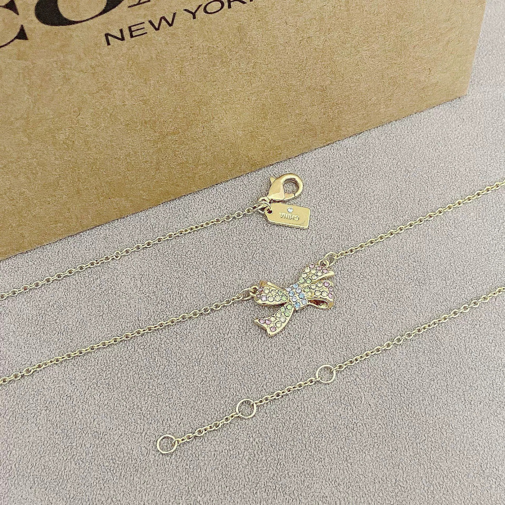 Coach Bow Rhinestone Necklace - Picture 2 of 6